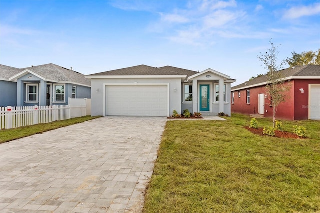 ranch-style house featuring a garage and a front lawn