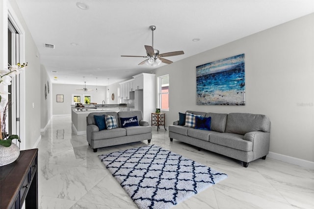 living room featuring ceiling fan