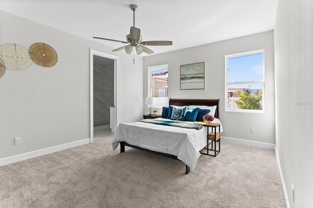 bedroom with ceiling fan and light carpet