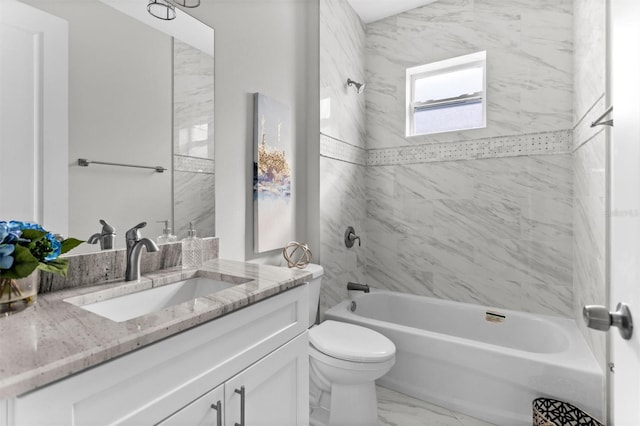 full bathroom with vanity, toilet, and tiled shower / bath