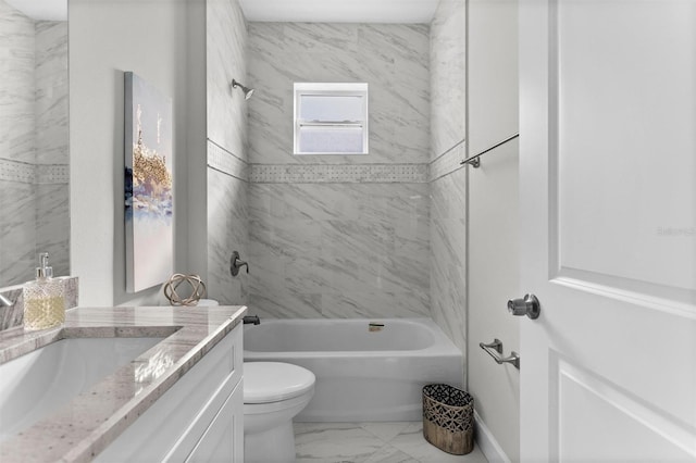 full bathroom featuring vanity, toilet, and tiled shower / bath