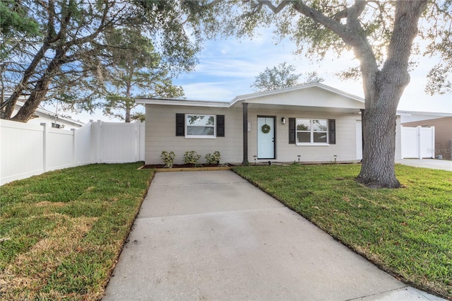 ranch-style home with a front yard