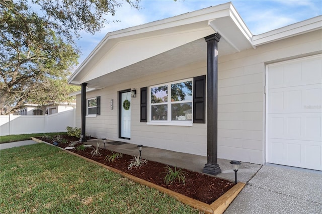 single story home featuring a garage and a front lawn