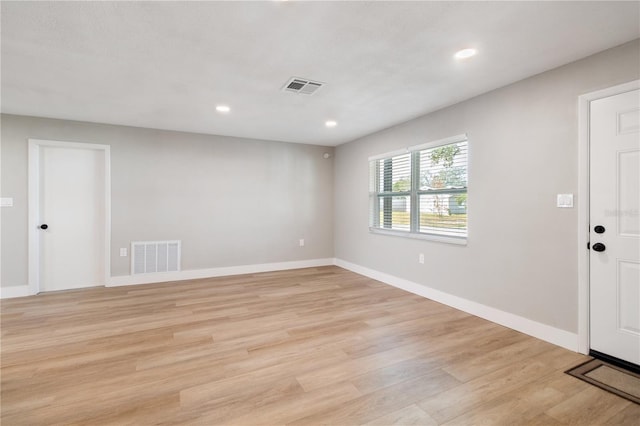 unfurnished room with light hardwood / wood-style floors