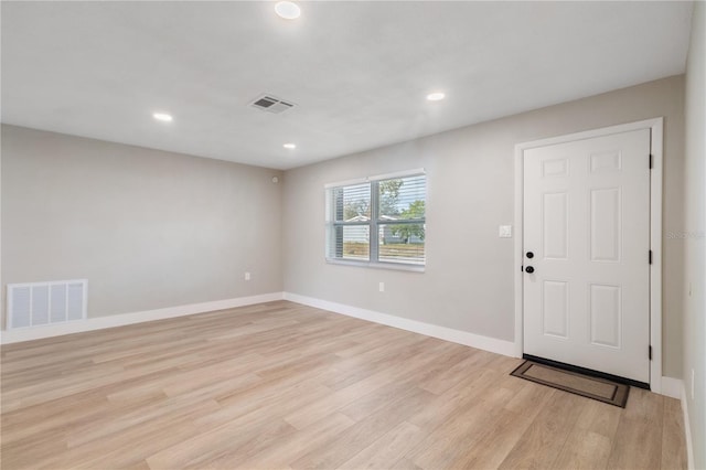 foyer entrance with light hardwood / wood-style flooring