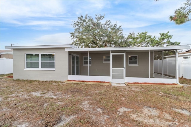 back of property featuring a sunroom