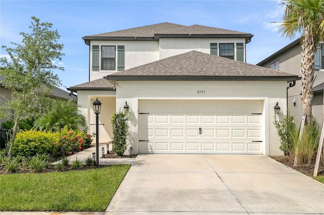 view of front of property with a garage