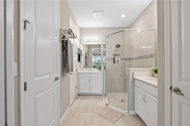 bathroom with vanity and walk in shower