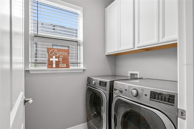 washroom with cabinets and separate washer and dryer