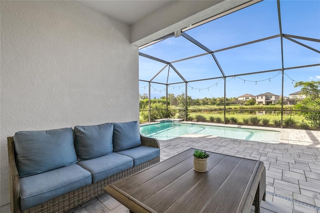 view of swimming pool with a lanai, an outdoor living space, and a patio area