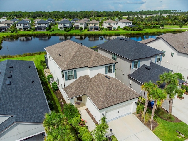 birds eye view of property with a water view