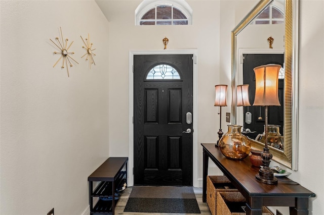 entrance foyer featuring a towering ceiling