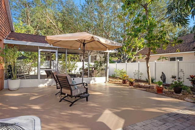 view of patio with a sunroom