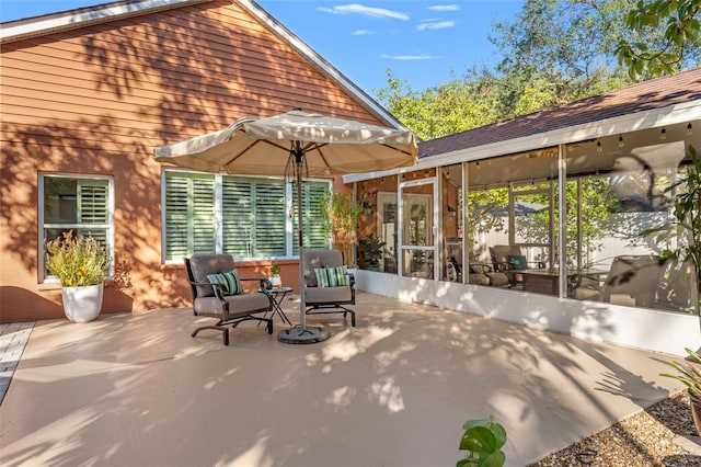 view of patio with a sunroom