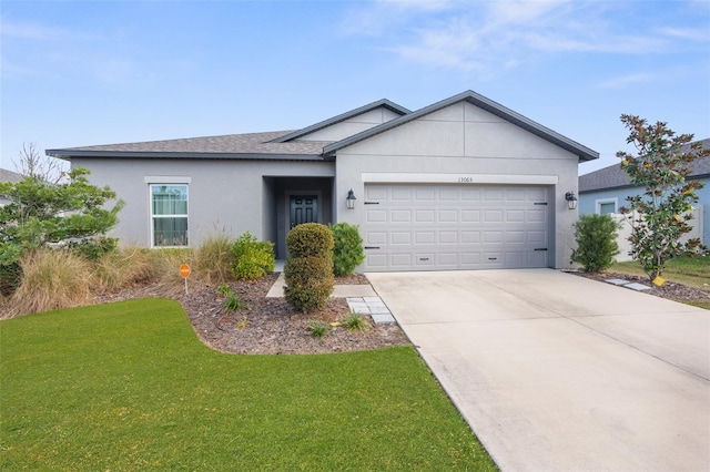 single story home with a garage and a front lawn