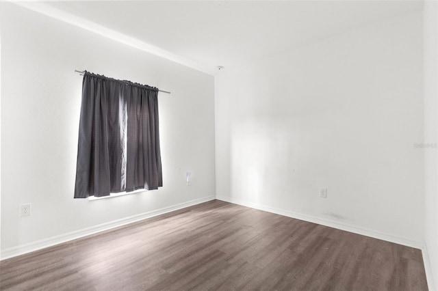 spare room with hardwood / wood-style flooring