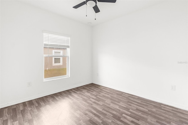 spare room with wood-type flooring and ceiling fan