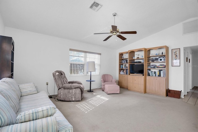 carpeted living room featuring vaulted ceiling and ceiling fan