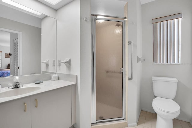 bathroom featuring tile patterned flooring, vanity, toilet, and an enclosed shower