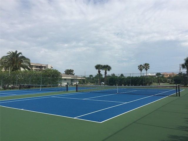 view of sport court with basketball hoop