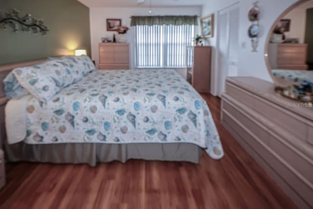 bedroom featuring a closet and wood finished floors