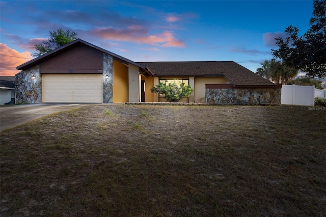 single story home featuring a garage