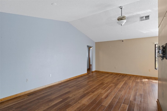 unfurnished living room featuring wood-type flooring, a textured ceiling, and vaulted ceiling