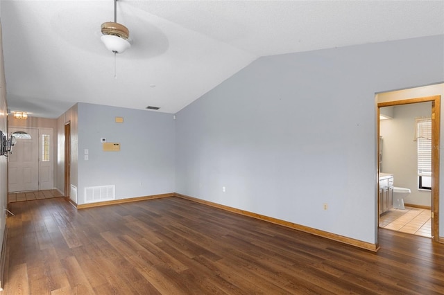 unfurnished living room with ceiling fan, wood-type flooring, and lofted ceiling