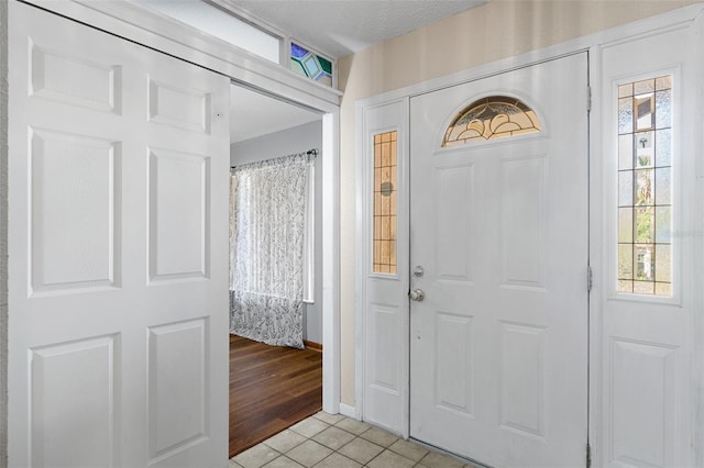 foyer with light tile patterned floors