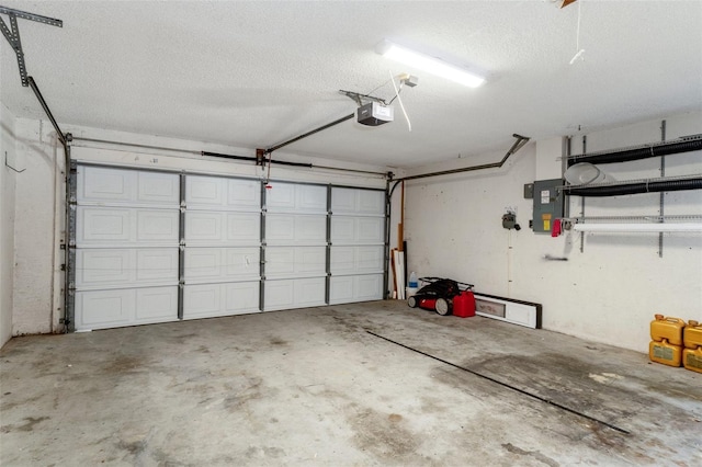 garage with electric panel and a garage door opener