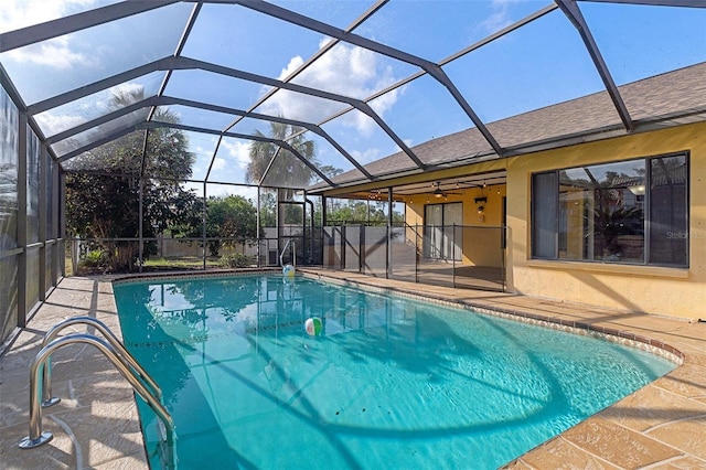 view of pool featuring a lanai, a patio area, and ceiling fan