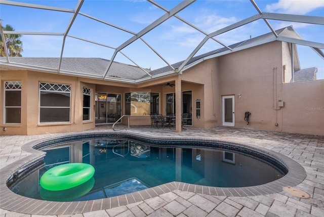 14101 Andrew Scott Rd, Spring Hill, FL 34609 - swimming pool with a patio area, a ceiling fan, glass enclosure, and outdoor dining space