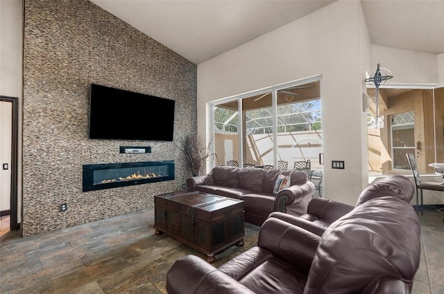 14101 Andrew Scott Rd, Spring Hill, FL 34609 - living area with vaulted ceiling, a fireplace, and stone finish flooring