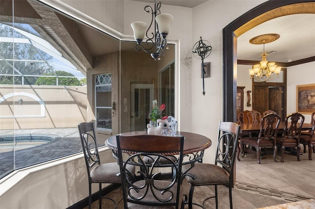 14101 Andrew Scott Rd, Spring Hill, FL 34609 - dining room with a chandelier and tile patterned floors