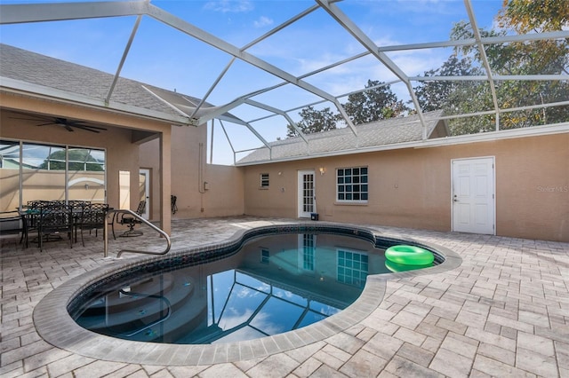 14101 Andrew Scott Rd, Spring Hill, FL 34609 - outdoor pool featuring a patio area, glass enclosure, ceiling fan, and outdoor dining space