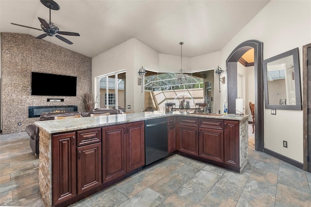 14101 Andrew Scott Rd, Spring Hill, FL 34609 - kitchen with dishwashing machine, open floor plan, vaulted ceiling, ceiling fan, and arched walkways