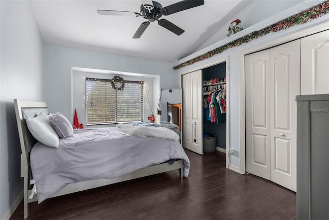 14101 Andrew Scott Rd, Spring Hill, FL 34609 - bedroom featuring vaulted ceiling, two closets, wood finished floors, and ceiling fan
