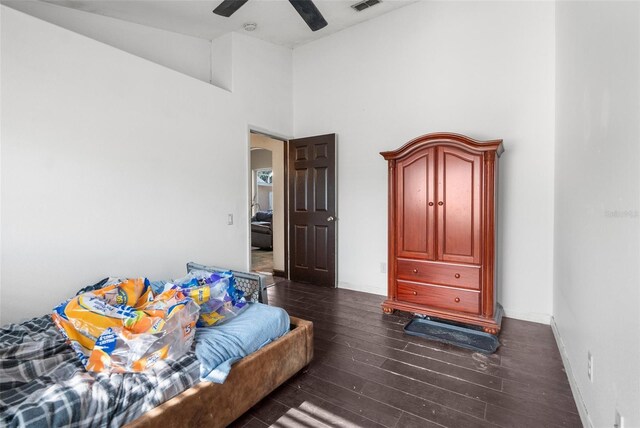 14101 Andrew Scott Rd, Spring Hill, FL 34609 - bedroom featuring dark wood finished floors, a ceiling fan, and a towering ceiling