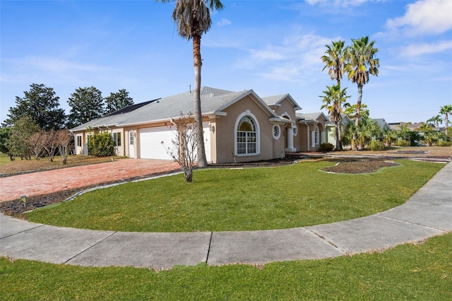 14101 Andrew Scott Rd, Spring Hill, FL 34609 - ranch-style home with driveway, an attached garage, stucco siding, and a front yard