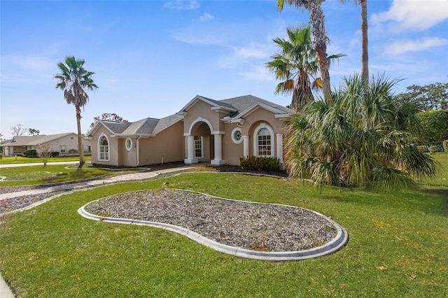 14101 Andrew Scott Rd, Spring Hill, FL 34609 - view of front facade with stucco siding and a front lawn