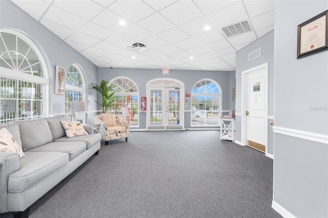 14101 Andrew Scott Rd, Spring Hill, FL 34609 - carpeted living area featuring a paneled ceiling and french doors