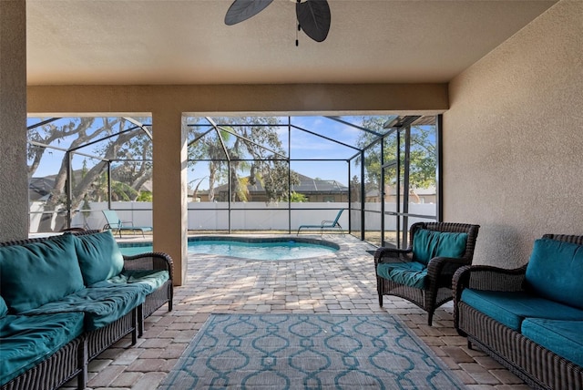 view of patio / terrace with glass enclosure, outdoor lounge area, and a fenced in pool