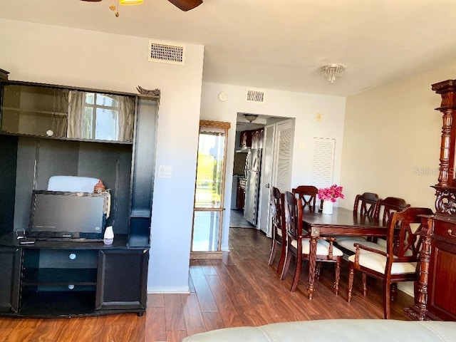 dining area featuring dark hardwood / wood-style floors, ceiling fan, and a wealth of natural light