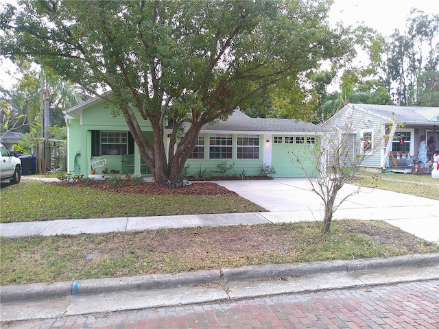 view of front facade featuring driveway and an attached garage