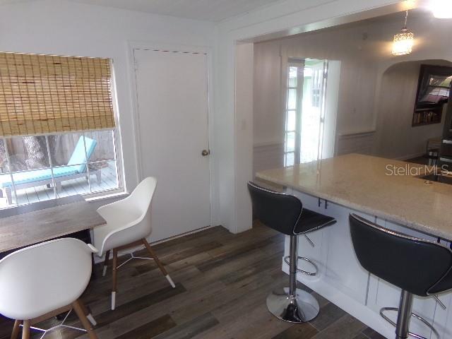 home office featuring dark wood-type flooring