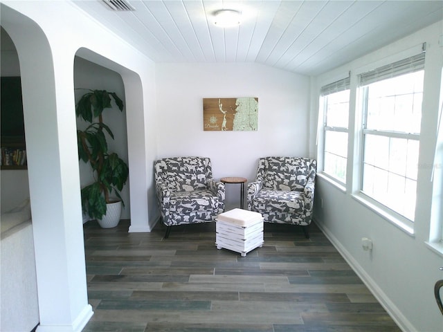 sitting room featuring wood ceiling, baseboards, vaulted ceiling, and wood finished floors