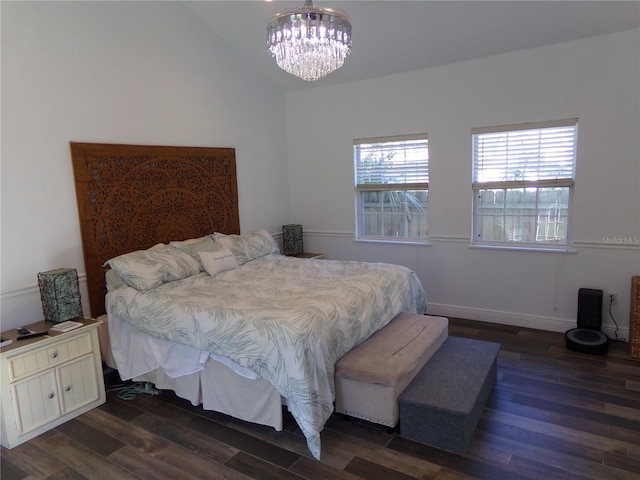 bedroom with vaulted ceiling, baseboards, dark wood finished floors, and an inviting chandelier