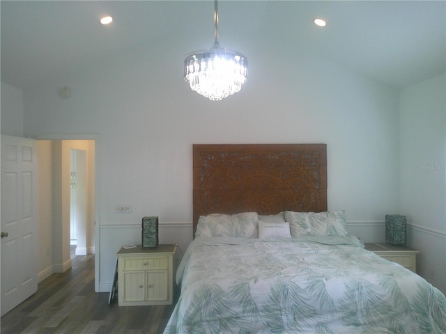 bedroom with lofted ceiling, recessed lighting, an inviting chandelier, and wood finished floors