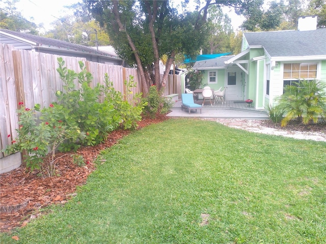 view of yard featuring a patio and a fenced backyard