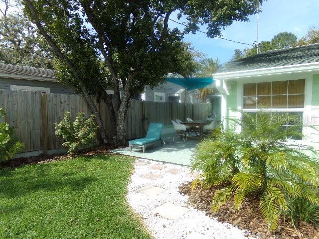 view of yard featuring a patio area and fence